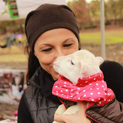 Steph Rivetti with rescued lamb
